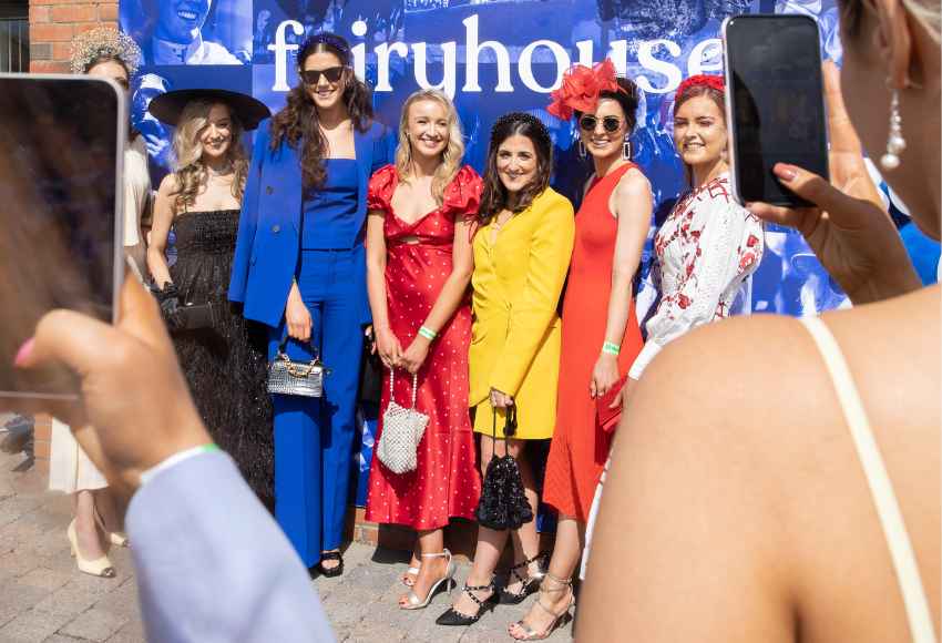 Ladies pose for the camera all dressed up 